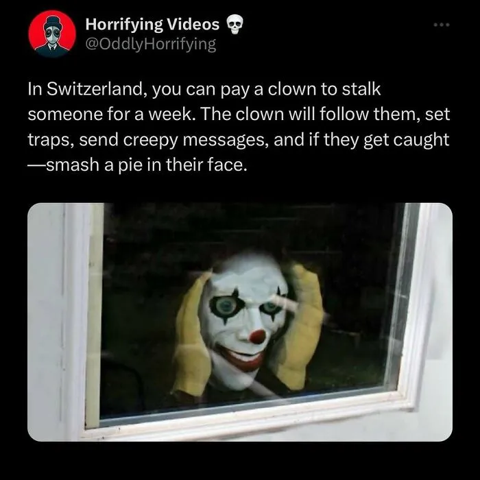 Creepy clown with red nose and eerie grin peering through a window, embodying an unnerving and oddly horrifying presence.