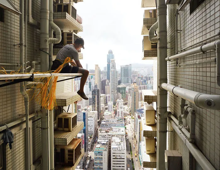 Fixing The Base, 2024 - A Man Is Attaching The Metallic Support That Will Serve As The Base Of The Bamboo Scaffolding