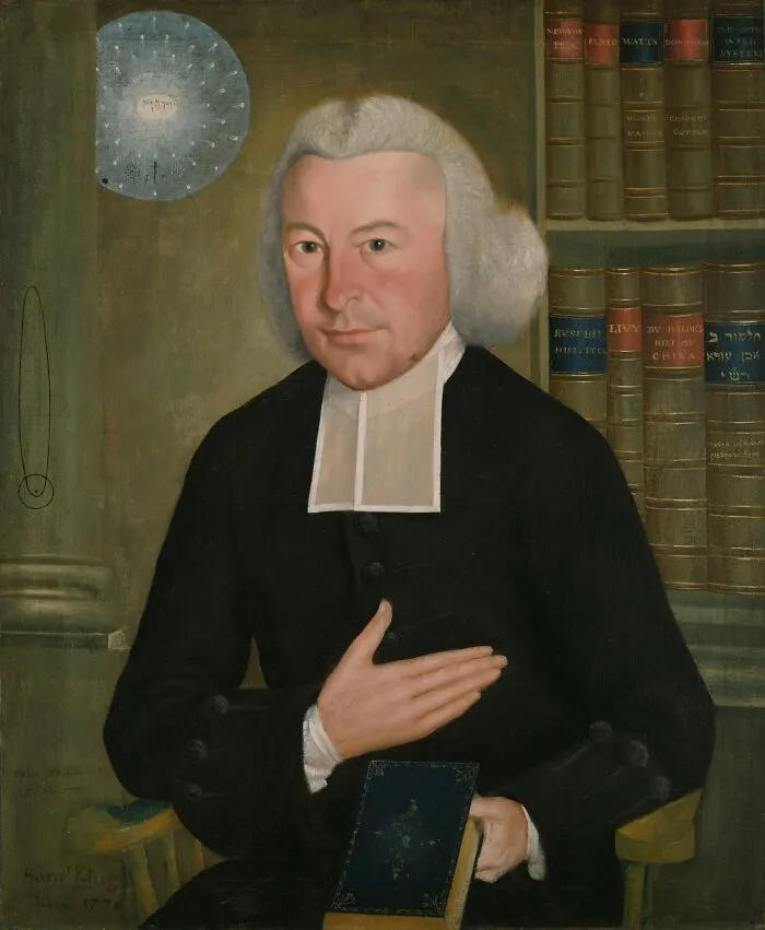 A historical figure in 18th-century attire holding a book, surrounded by shelves of old books, possibly linked to future predictions.