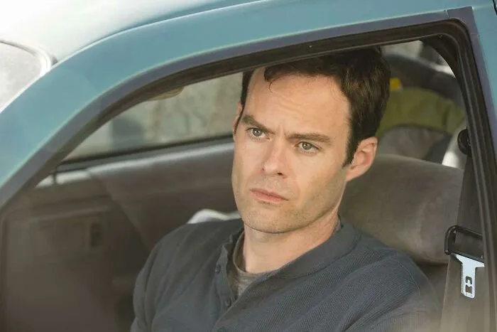 Man sitting in a car, lost in thought; scene from a consistently excellent TV show.