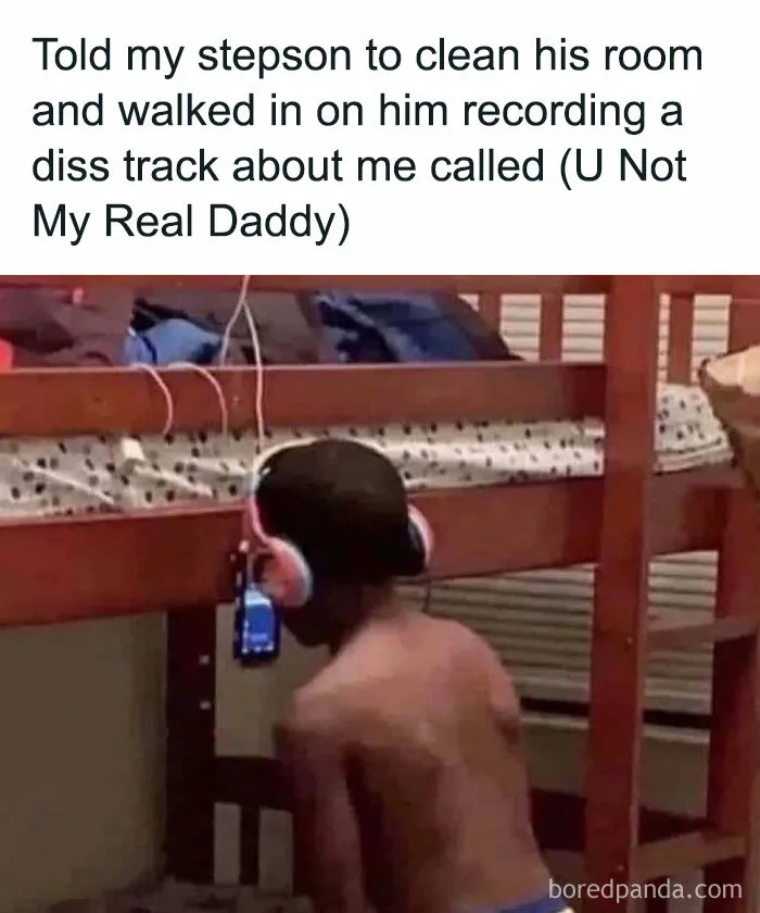 Boy recording a diss track in his room, wearing headphones in a humorous meme about men and parenting.