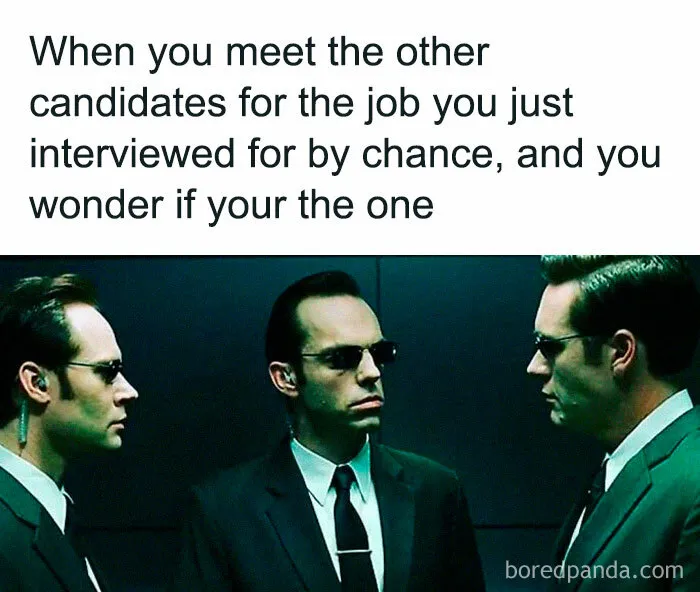 Three men in suits and sunglasses with a job interview caption, highlighting funny relatable work memes.