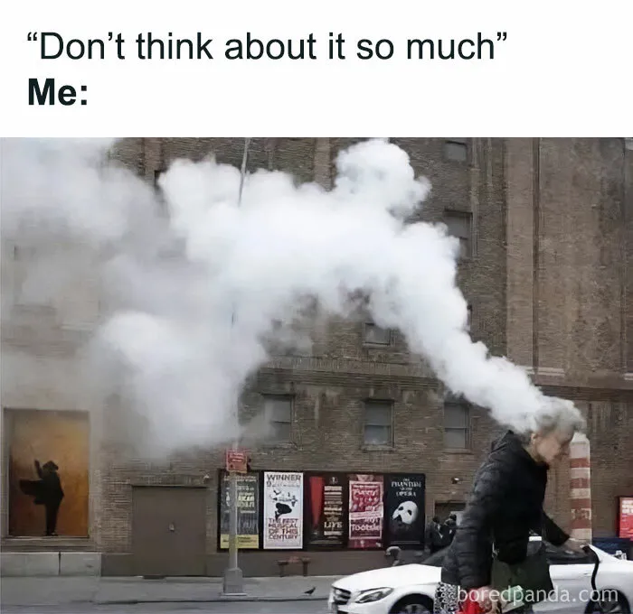 Person walking on city street with large cloud of steam around head, illustrating funny random shower thoughts concept.
