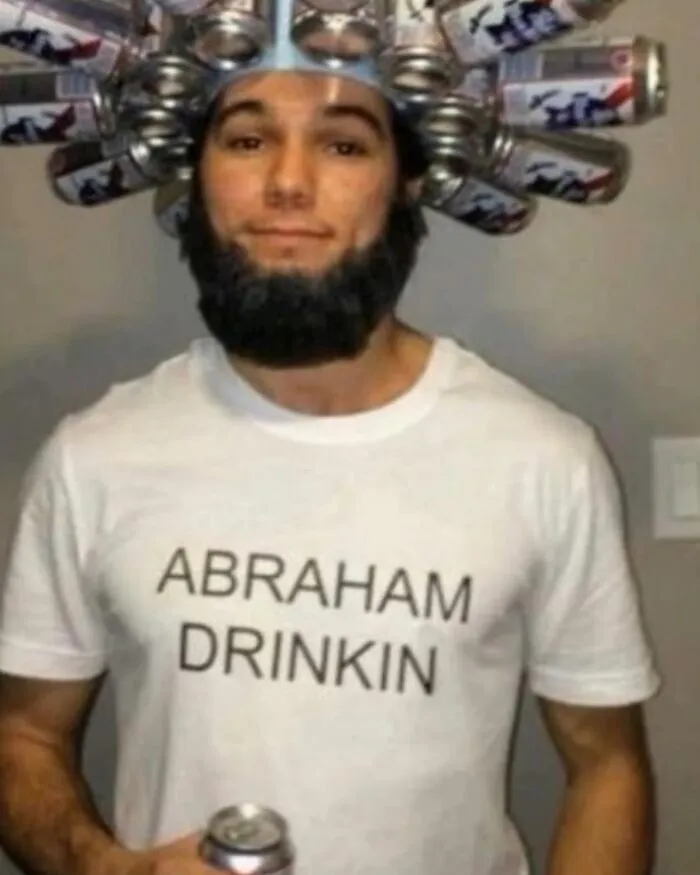 Man wearing a beer can hat and a shirt that says Abraham Drinkin, one of the uncomfortable images for no apparent reason.