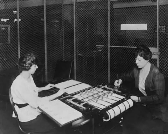 Two Women Using Check Signing Machine Which Signs Checks Issued By The War Risk Bureau
