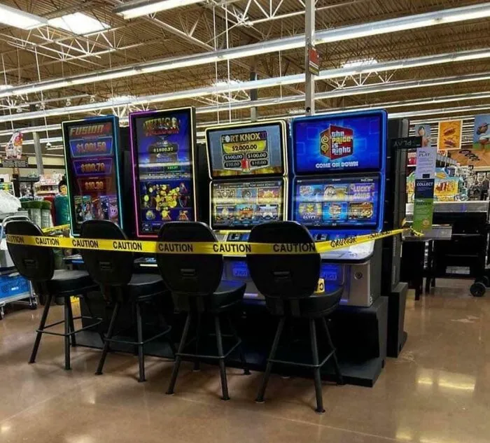 Slot machines in a US store surrounded by caution tape, illustrating current life in the US through Americans' perspective.
