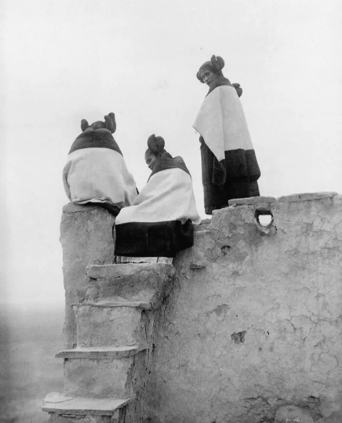 Three Hopi Women At Top Of Adobe Steps