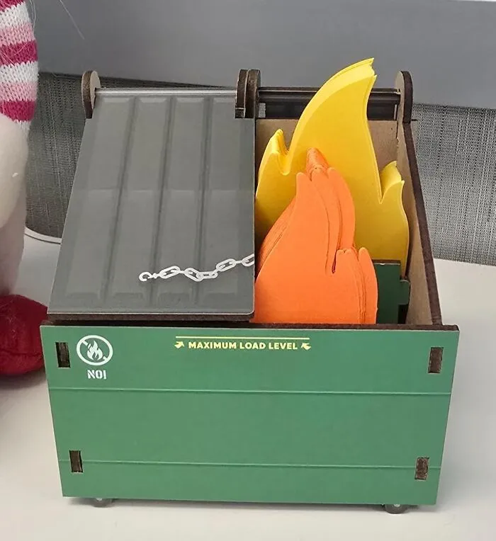 Honestly, Your Monday Morning Meetings Probably Feel Like They're Taking Place Inside This <a Style="Display:inline;" Href="Https://Www.amazon.com/Genuine-Fred-Dumpster-Assorted-5280917/Dp/B08vn8vtqq?ie=utf8&th=1&linkcode=ll1&tag=bpsheep-20&linkid=cc5675e5c36409530e78d6350fdbed7f&language=en_us&ref_=as_li_ss_tl" Target="_blank"><span Style="Font: Inherit; Color: #d74b1f;"> Dumpster Fire Pen Holder </Span>, So At Least Your Pens Can Now Have A Thematically Appropriate Place To Live Through The Chaos
