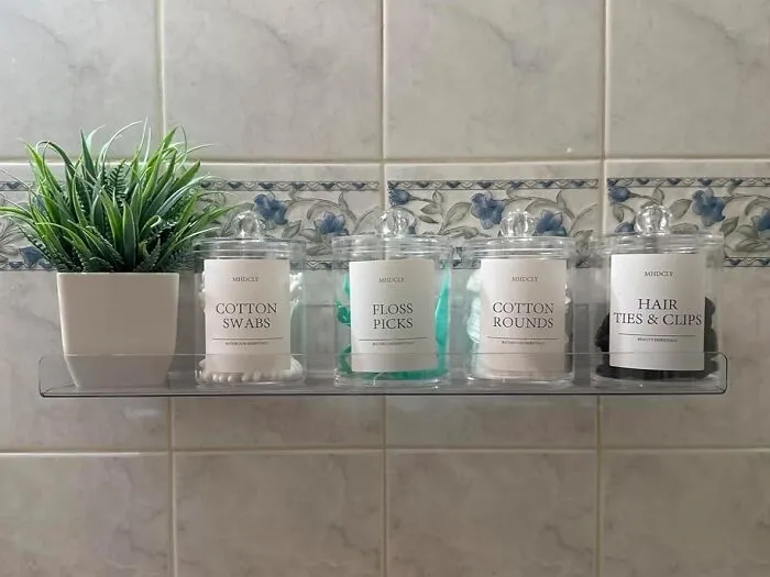 Those Sad Plastic Bags Of Cotton Rounds Are Officially Getting A Glow-Up, Because These <a Style="Display:inline;" Href="Https://Www.amazon.com/Mhdcly-Organizers-Accessories-Organization-Aesthetic/Dp/B0cy4786zd?ie=utf8&th=1&linkcode=ll1&tag=bpalpaca-20&linkid=56eb6d652aec96a54c523f6e5bbd47a4&language=en_us&ref_=as_li_ss_tl" Target="_blank"><span Style="Font: Inherit; Color: #d74b1f;"> Apothecary Jars For Bathroom Organising </Span> Are Here To Make Your Bathroom Counter Look Like It Actually Belongs To A Grown-Up