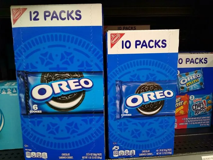 Boxes of Oreo cookies showing smaller product sizes on store shelves, illustrating products getting smaller and more expensive.