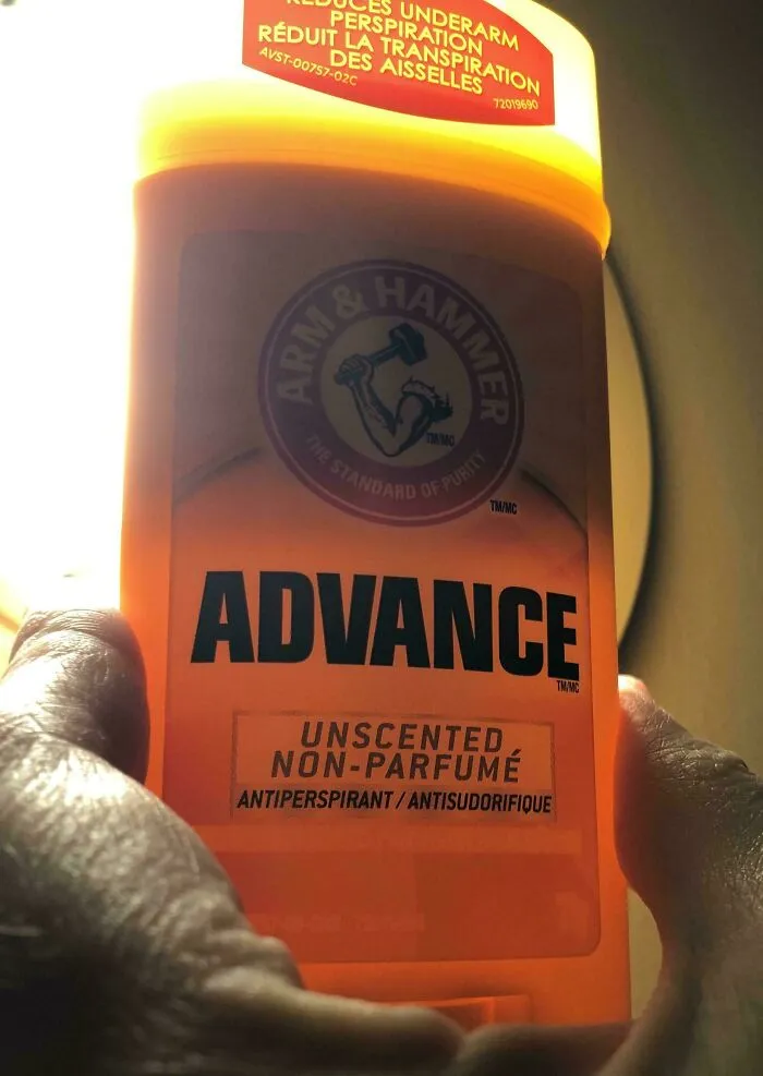 Close-up of a smaller Arm & Hammer Advance unscented antiperspirant deodorant held in hand, highlighting product size.
