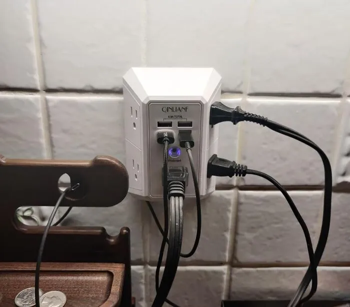 Your Wall Outlet Is About To Go From "Sadly Limited" To "Power Strip Party Central" With An <a Style="Display:inline;" Href="Https://Www.amazon.com/Charger-Protector-Qinlianf-Extender-Charging/Dp/B08r6s1m1k?ie=utf8&th=1&linkcode=ll1&tag=bpgoose-20&linkid=d84dc8ff78af68b3f9c1cd6908cba2db&language=en_us&ref_=as_li_ss_tl" Target="_blank"><span Style="Font: Inherit; Color: #d74b1f;"> Outlet Extender With Built-In Surge Protector </Span>
