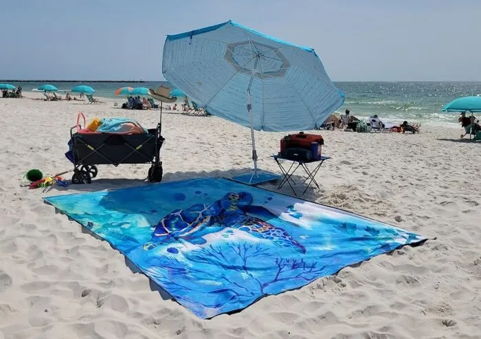 Your Entire Squad (And Probably Their Snacks Too) Can Comfortably Chill On The Sand With One Of These Absolutely Massive <a Style="Display:inline;" Href="Https://Www.amazon.com/Wiwigo-Blanket-Sandproof-Waterproof-Outdoor/Dp/B085xbqfvm?ie=utf8&linkcode=ll1&tag=bpshark-20&linkid=8d04ce46f2b28e53abda1fe3cd5529c7&language=en_us&ref_=as_li_ss_tl" Target="_blank"><span Style="Font: Inherit; Color: #d74b1f;"> Extra Large Beach Blanket </Span> Wonders