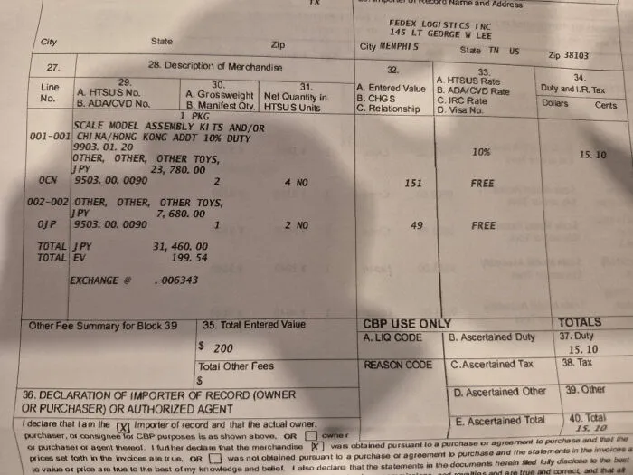 Receipt showing import details of toys with tariff charges, illustrating the impact of high tariffs on regular Americans.