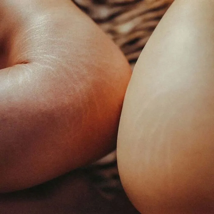 Close-up of intimate, cinematic-looking shot capturing natural skin texture using vintage cameras by a photographer.
