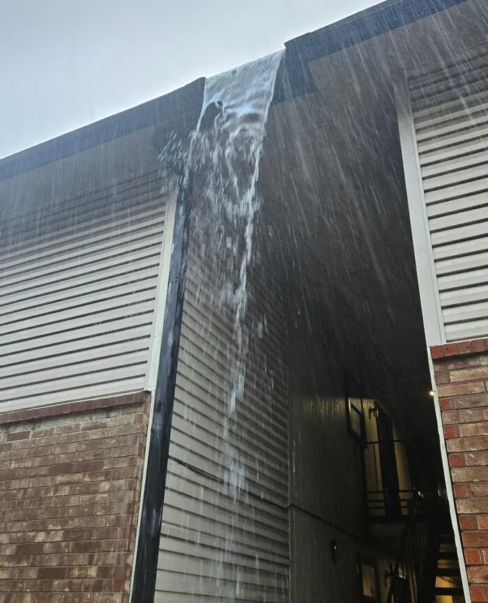 Waterfall Over The Entrance To My Apartment When It Rains. No The Gutters Aren't Full. It's Designed This Way