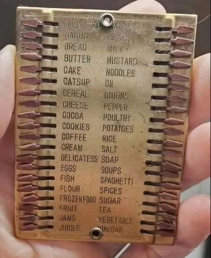 Old metal pantry inventory board with matchsticks for tracking strange things found in homes with hidden pasts.