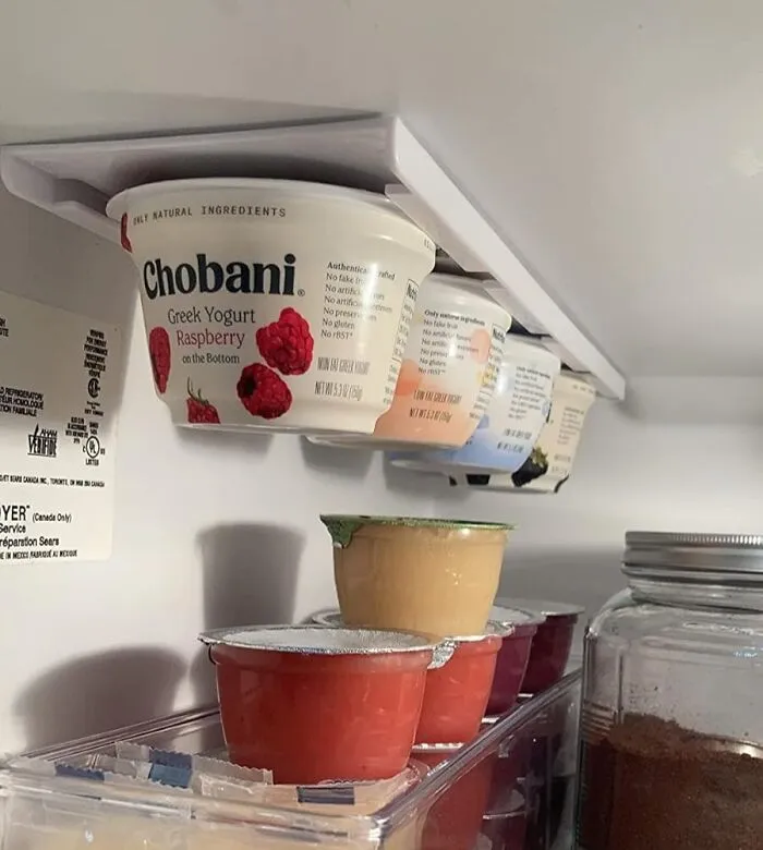 Your Yogurts Can Finally Live That Coveted Loft Life, Suspended From The Top Of Your Tiny Kitchen Fridge Thanks To <a Style="Display:inline;" Href="Https://Www.amazon.com/Storage-Theory-Refrigerator-Organizer-Hardware/Dp/B078y9cvwn?ie=utf8&th=1&linkcode=ll1&tag=bpbat-20&linkid=fae7b512fd7d1b6cb29be65878b6f0e8&language=en_us&ref_=as_li_ss_tl" Target="_blank"><span Style="Font: Inherit; Color: #d74b1f;"> This Fridge Ceiling Yogurt Holder</Span> That Reclaims Wasted Space Like A Tiny Real Estate Mogul