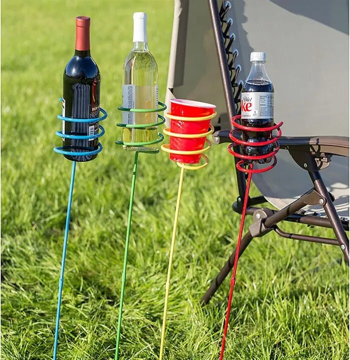 Finally, Your Picnic Beverages Can Stand Tall And Proud Instead Of Precariously Wobbling On Uneven Ground, All Thanks To <a Style="Display:inline;" Href="Https://Www.amazon.com/Dp/B0168ob3wk?ascsubtag=7426242%2c15%2c28%2cd%2c0%2c0%2c0%2c1396%3a1%3b900%3a2%3b974%3a1%3b1338%3a1%2c31159101%2c0%2c0%2cgoogle&btn_ref=srctok-Ffd019741477e78e&th=1&linkcode=ll1&tag=bpraccoon-20&linkid=397f53b0d2eadda95c184035216053ff&language=en_us&ref_=as_li_ss_tl" Target="_blank"><span Style="Font: Inherit; Color: #d74b1f;"> These Outdoor Drink Holder Stakes</Span> That Firmly Plant Your Refreshments Where They Belong