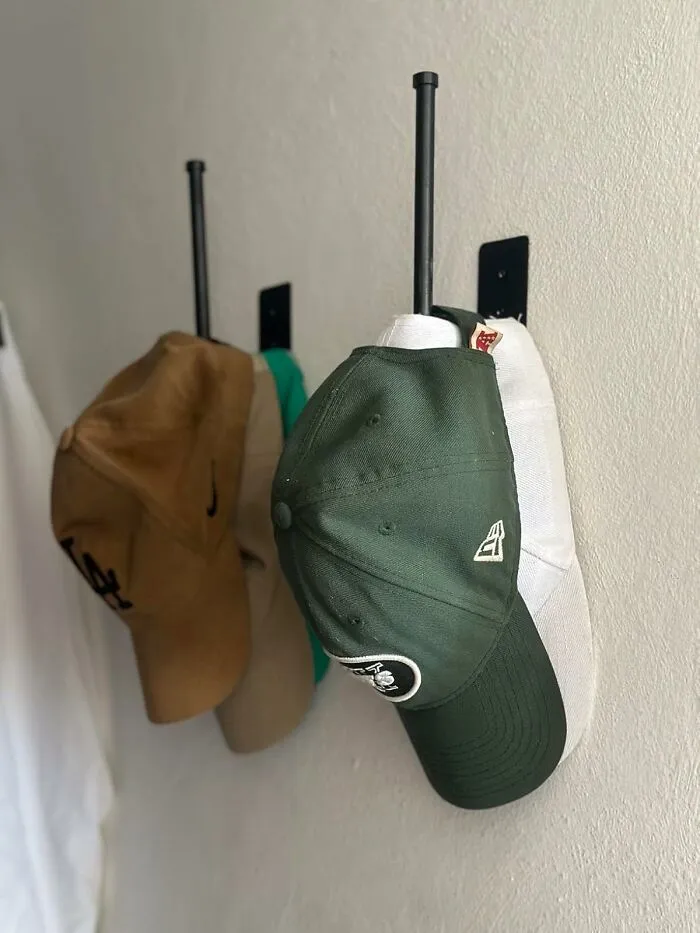 Finally, A Way To Display Your Impressive Cap Collection That Doesn't Involve A Precarious Leaning Tower On Your Dresser, Thanks To These <a Style="Display:inline;" Href="Https://Www.amazon.com/Durmmur-Baseball-Stainless-Organizer-Adhesive/Dp/B0cz6xt4qy?ie=utf8&th=1&linkcode=ll1&tag=bpseahorse-20&linkid=c2b8ef818b07959789d0557dd182273d&language=en_us&ref_=as_li_ss_tl" Target="_blank"><span Style="Font: Inherit; Color: #d74b1f;"> Hat Racks For Baseball Caps </Span>