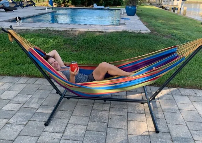 That Awkward Patch Of Grass In Your Backyard Is About To Achieve Its True Calling As Your Personal Relaxation Zone, All Thanks To This <a Style="Display:inline;" Href="Https://Www.amazon.com/Vivere-Double-Hammock-Space-Saving-Tropical/Dp/B004yjcp7o?ie=utf8&th=1&linkcode=ll1&tag=bppony-20&linkid=60f214f75b472d5aae8df6f4bc21a3c5&language=en_us&ref_=as_li_ss_tl" Target="_blank"><span Style="Font: Inherit; Color: #d74b1f;"> Cotton Hammock On A Steel Stand </Span>, Which Is Basically A One-Way Ticket To Peak Outdoor Chill