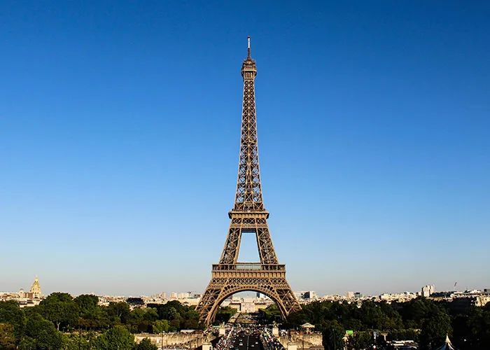 Eiffel Tower under clear blue sky, symbolizing entertaining facts people shared in this thread on X platform.