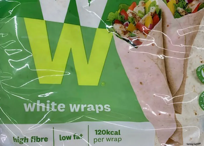 Package of white wraps with vegetables inside, illustrating one of the worst gifts people have ever received.