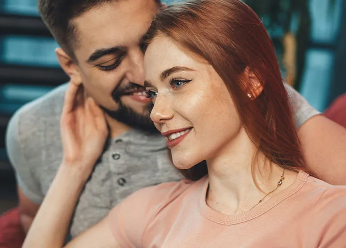 Couple sharing a tender moment indoors, highlighting emotions connected to the worst gifts they’ve ever received.
