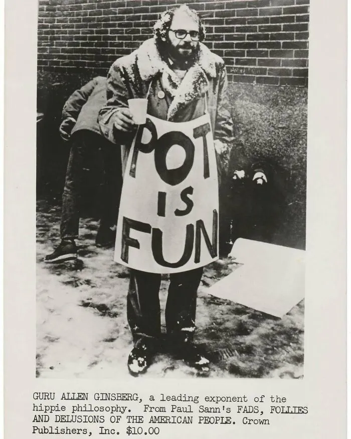 Black and white vintage photo of a man wearing a "Pot is Fun" sign, showcasing captivating history moments.