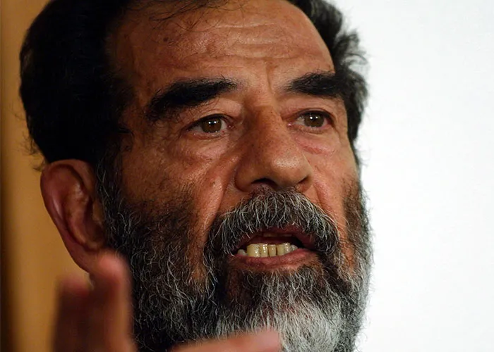 Close-up of a bearded man speaking passionately, representing events from the past that people can’t stop researching.