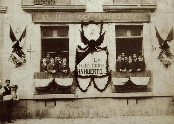 Vintage photo of people on balconies during a historical event, highlighting past moments people can’t stop researching.