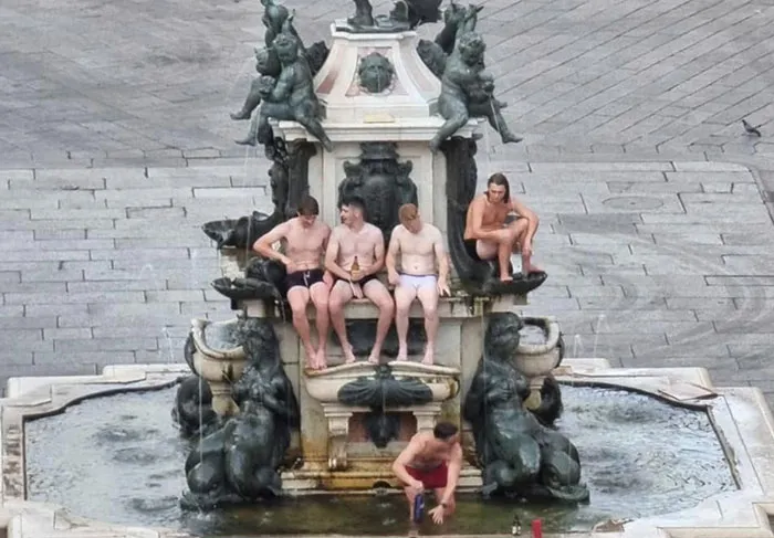 Irish Tourists In Bologna, Italy Fined €500 Each After They Stripped Down To Their Underwear And Mounted The Neptune Fountain