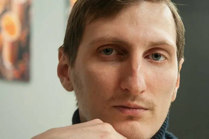 Close-up of a man showing subtle body changes that indicate you are clearly getting older and facing aging signs