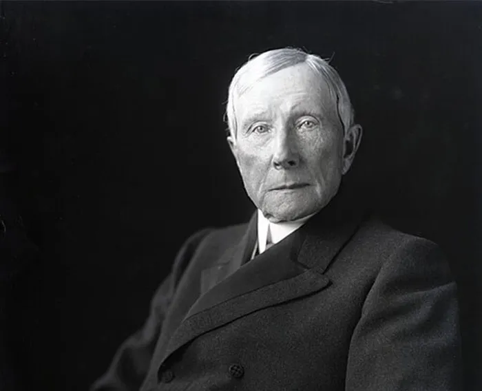 Black and white photo of an older man in a suit, representing Steve Jobs and celebrities praised after passing.