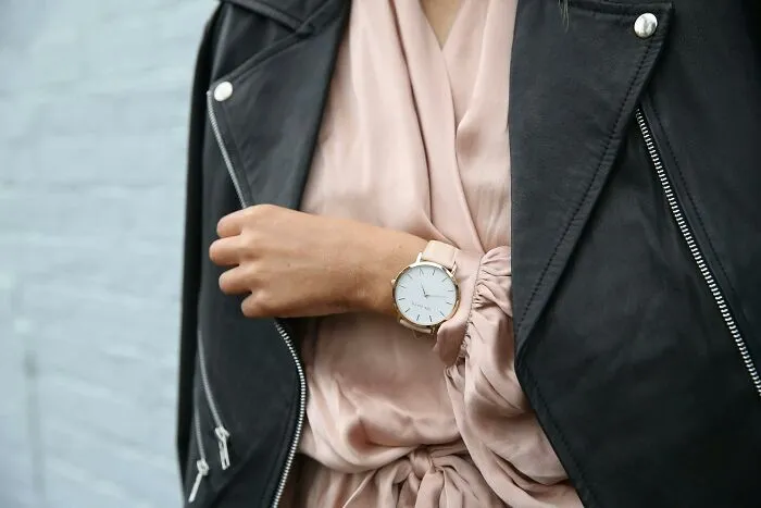 Close-up of a person wearing a watch and a black leather jacket, illustrating people recalling out-of-touch statements.