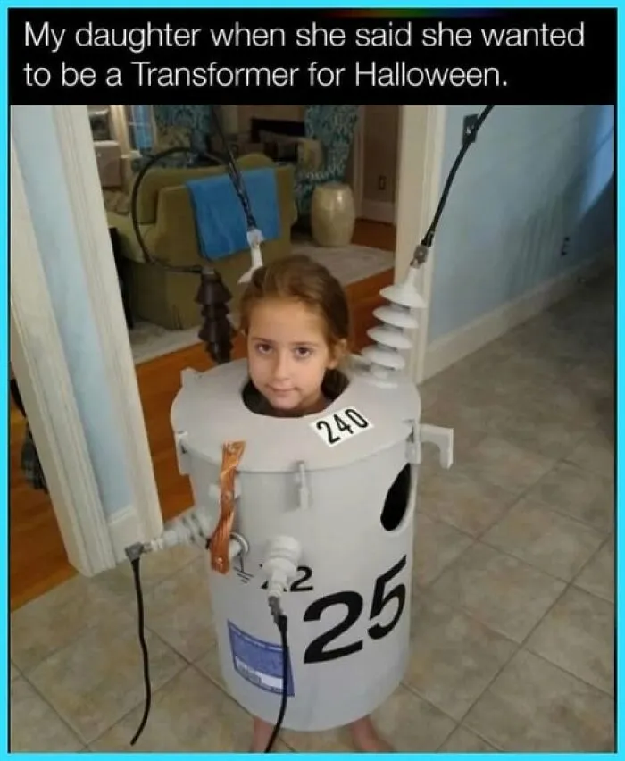 Young girl in a homemade transformer costume standing indoors, showcasing one of the hilariously sarcastic memes.