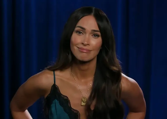 Woman with long dark hair in a teal and black lace top sharing insights about people who knew celebrities before fame