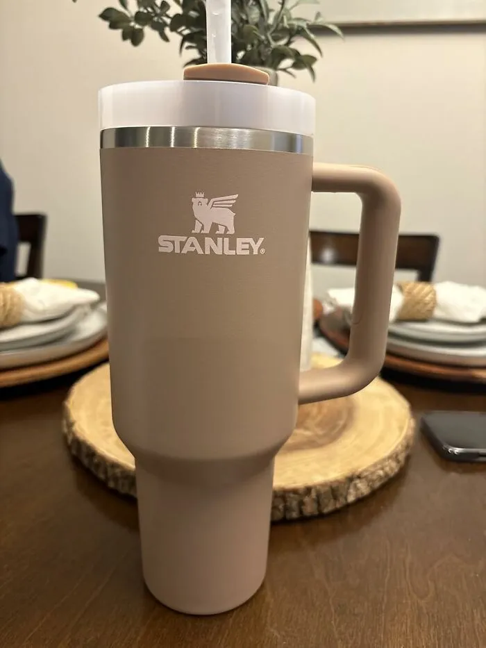 Because Staying Hydrated On A Hot Beach Is Less Of A Suggestion And More Of A Survival Tactic, This Legendary <a Style="Display:inline;" Href="Https://Www.amazon.com/Quencher-Flowstate-Stainless-Insulated-Smoothie/Dp/B0cjzzns72?ie=utf8&th=1&linkcode=ll1&tag=bpowl-20&linkid=a86c71bec9c0f02218f92df952a79701&language=en_us&ref_=as_li_ss_tl" Target="_blank"><span Style="Font: Inherit; Color: #d74b1f;"> 40 Oz Stanley Quencher</Span> Is Basically Your Personal Liquid Life Support System