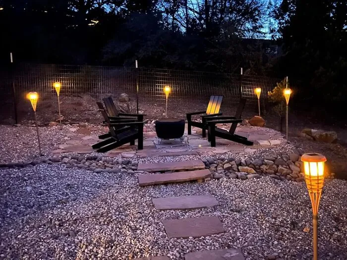 Your Backyard's About To Get That "Survivor: Island Of The Idols" Glow-Up, Minus Jeff Probst And All The Backstabbing, Thanks To These <a Style="Display:inline;" Href="Https://Www.amazon.com/Evelynsun-Flickering-Flames-Powered-Lights/Dp/B08v8k5nxz?ie=utf8&th=1&linkcode=ll1&tag=bpsheep-20&linkid=1f69d1c41de474c7b366160ff0e6f65b&language=en_us&ref_=as_li_ss_tl" Target="_blank"><span Style="Font: Inherit; Color: #d74b1f;"> Solar Tiki Torches With Flickering Flames</Span>