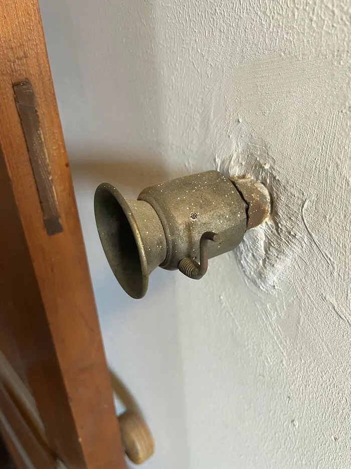 Metal Cylinder In Wall Of 1800s House With A Little Lever And Flap