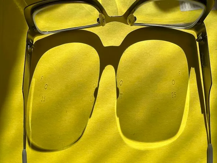 These Letters And Numbers Are Invisible On My Lenses, But Cast Shadows