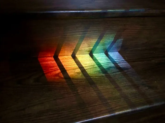 The Way The Railing’s Shadow Divided Up The Colours Of The Rainbow Reflection On My Stairs