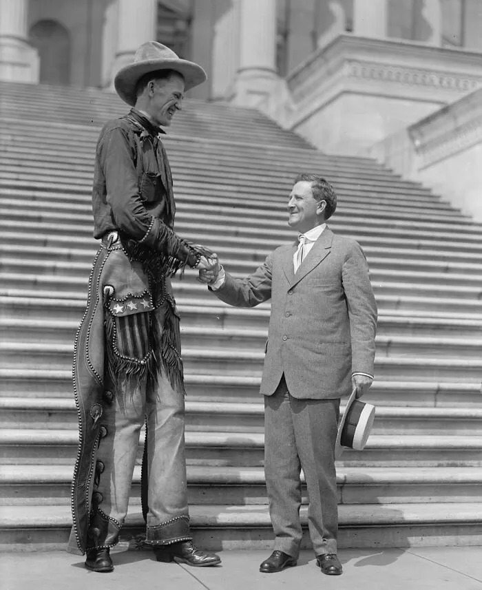 Madsen, Ralph E. The Tall Cowboy. At Capitol, Shaking Hands With Senator Morris Sheppard, 1919