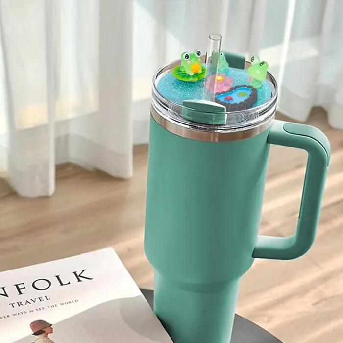 Your Emotional Support Water Bottle Is About To Get Its Own Adorable Emotional Support Squad With This <a Style="Display:inline;" Href="Https://Www.amazon.com/Compatible-Stanley-Accessories-Silicone-Tumblers/Dp/B0dbymvcmv?content-ID=amzn1.sym.2da95b6c-F59a-4699-Bc43-D0ff036c6388%3aamzn1.sym.2da95b6c-F59a-4699-Bc43-D0ff036c6388&crid=2ku1xc7deqmo1&cv_ct_cx=stanley%2bcup%2bcharm&keywords=stanley%2bcup%2bcharm&pd_rd_i=b0dbymvcmv&pd_rd_r=fbc5f789-4d92-495d-B662-958fe9b4ea1d&pd_rd_w=ypcoq&pd_rd_wg=acs2n&pf_rd_p=2da95b6c-F59a-4699-Bc43-D0ff036c6388&pf_rd_r=mjkg9ry4tm6qqy5za8js&qid=1749555079&sbo=rzvfv%2f%2fhxdf%2bo5021pansa%3d%3d&sprefix=stanley%2bcup%2bcha%2caps%2c304&sr=1-1-6024b2a3-78e4-4fed-8fed-E1613be3bcce-Spons&sp_csd=d2lkz2v0tmftzt1zcf9zzwfyy2hfdghlbwf0awm&th=1&linkcode=ll1&tag=bpsquirrel-20&linkid=89f0c73c877d85d47f4d5536dbec29aa&language=en_us&ref_=as_li_ss_tl" Target="_blank"><span Style="Font: Inherit; Color: #d74b1f;"> Stanley Cup Lid Decor</Span> Featuring Two Chill Frogs Just Vibin' In Their Tiny Pond