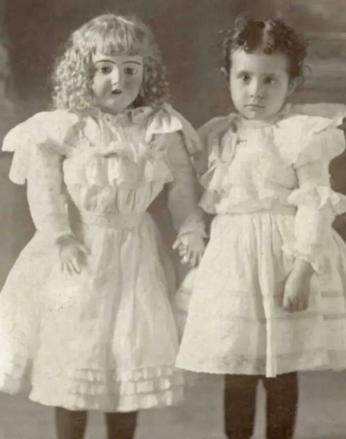 A Young Girl And Her Very Large Doll, Ca. 1900