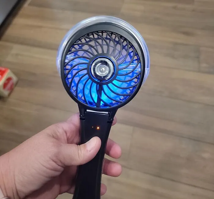 When The Beach Breeze Decides To Take An Unscheduled Nap And You're Feeling Approximately One Degree Away From Spontaneous Combustion, This <a Style="Display:inline;" Href="Https://Www.amazon.com/Handfan-Handheld-Operated-Rechargeable-Nightlights/Dp/B087zwhvc7?ie=utf8&th=1&linkcode=ll1&tag=bpowl-20&linkid=29936e4c97726bd6165f2c0ffa03579d&language=en_us&ref_=as_li_ss_tl" Target="_blank"><span Style="Font: Inherit; Color: #d74b1f;"> Handheld Misting Fan</Span> Is Your Tiny, Personal Oasis