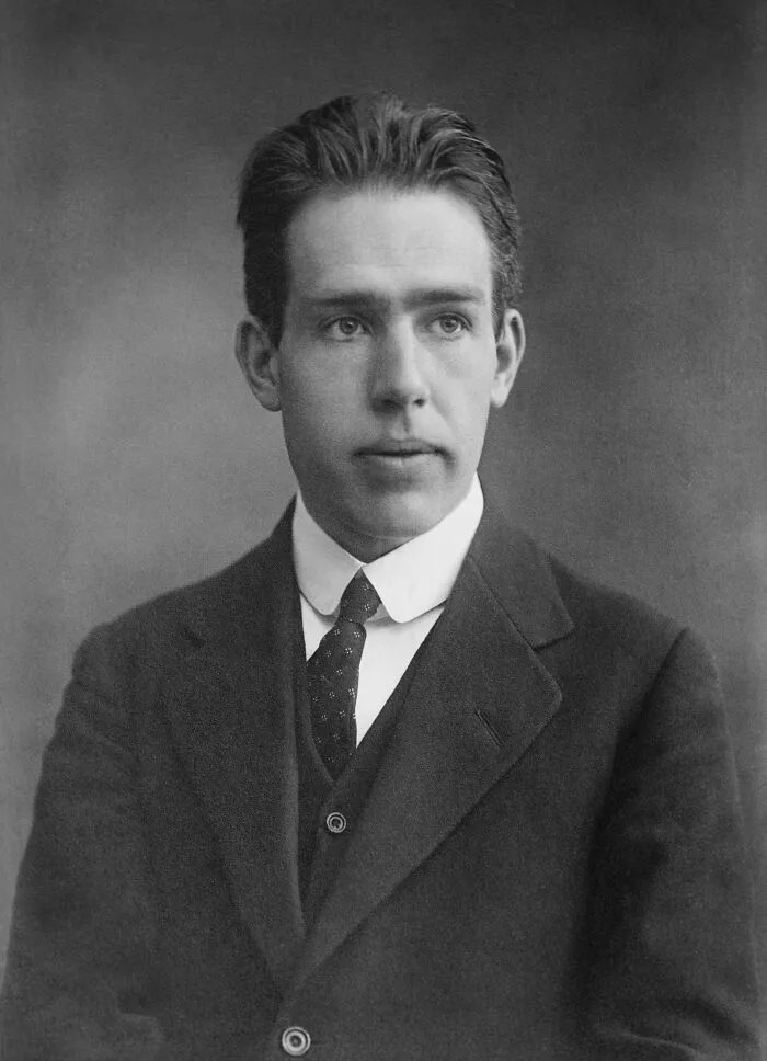Black and white portrait of a handsome historical figure in a suit and tie, showcasing famous names from history.