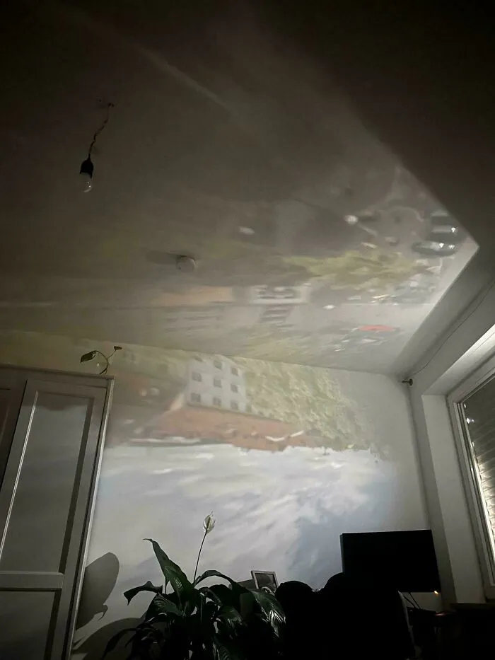 At A Certain Hour, The Sun Reflects A Projection Of My City Through A Hole In My Blinds