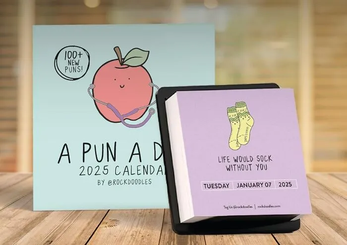 Survive The Soul-Crushing Monotony Of The Work Week One Groan-Worthy Pun At A Time With This Essential <a Style="Display:inline;" Href="Https://Www.amazon.com/Rockdoodles-Punny-Calendar-Desktop-Office/Dp/B0ck3lhztb?content-ID=amzn1.sym.bf491aa8-B307-4a36-Bb91-Bc4611147923%3aamzn1.sym.bf491aa8-B307-4a36-Bb91-Bc4611147923&cv_ct_cx=funny%2boffice%2bsupplies&keywords=funny%2boffice%2bsupplies&pd_rd_i=b0ck3lhztb&pd_rd_r=b3fafb15-Cccd-4597-B842-Da16ad1877d3&pd_rd_w=0hno9&pd_rd_wg=jfowh&pf_rd_p=bf491aa8-B307-4a36-Bb91-Bc4611147923&pf_rd_r=ambqwwswjpd4sjvryg18&qid=1749795907&sbo=rzvfv%2f%2fhxdf%2bo5021pansa%3d%3d&sr=1-2-Baa1f287-65d3-41a3-A655-8bbba0531537-Spons&sp_csd=d2lkz2v0tmftzt1zcf9zzwfyy2hfdghlbwf0awm&th=1&linkcode=ll1&tag=bpant-20&linkid=dde3dc2ab4968d467dd7ee93f27ce1da&language=en_us&ref_=as_li_ss_tl" Target="_blank"><span Style="Font: Inherit; Color: #d74b1f;"> Punny Daily Desk Calendar</Span>