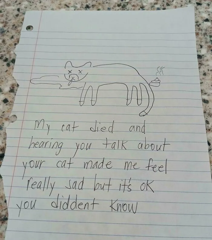 Handwritten note with a child’s drawing of a cat and a message, an unusual historical memento people randomly found.